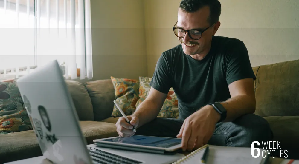 Joe Martin working at a laptop at home